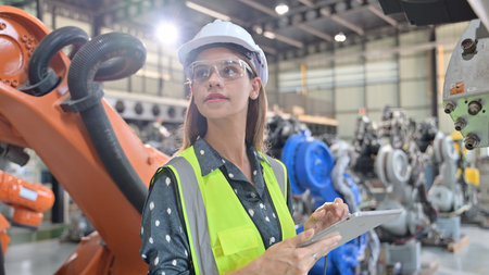 Business owner engineer managing and checking work at factory