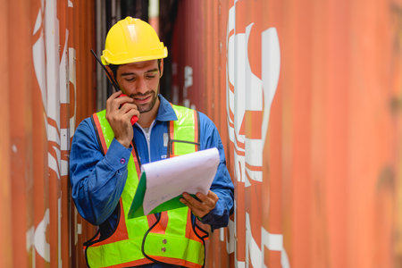 Industrial engineer worker working at overseas shipping container yard
