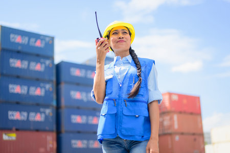 Warehouse engineer worker working at industrial container yardの写真素材