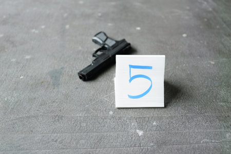 Police find rejected gun used by murderer, Evidence of murderの写真素材