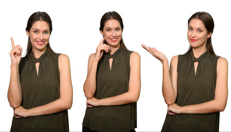 Portrait of happy businesswoman standing on white studio backgroundの写真素材