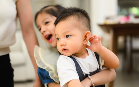 Happy and cheerful family spending good time together at homeの写真素材