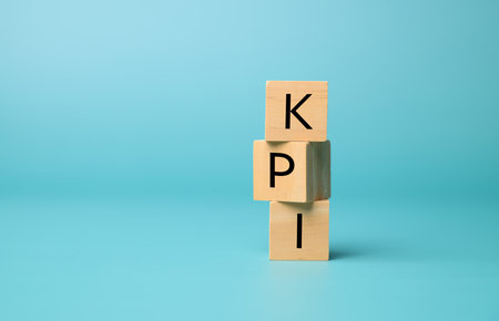 Key performance indicator, Businessman holding wooden cube with KPIの写真素材