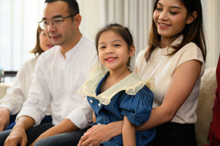 Portrait of happy family spending good time together at homeの写真素材