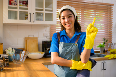 Happy woman cleaning house, Housekeeping and cleaning service, People doing housework at home