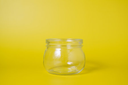 Empty small glass jar for money saving, Cash money dollars, Business investment and income, Global financial crisis, Empty jar for donation, Financial investmentの写真素材