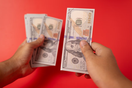 People holding many hundred dollar bills and banknotes for money saving, American dollars, Cash...