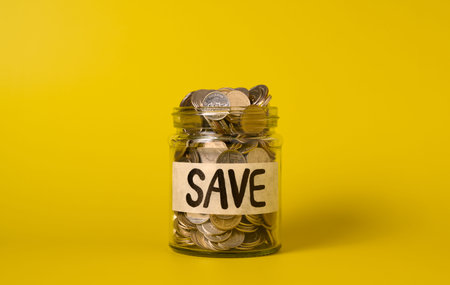 Coins in glass jar, Financial business investment, Growing money, People saving money, Money for future, Money saving conceptの写真素材