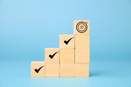 Wooden block of target board with business icons, Business strategy planning management, Progress of...