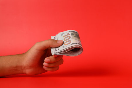 Hand holding banknotes, Cheating in business with illegal money, Businessman giving or receiving...