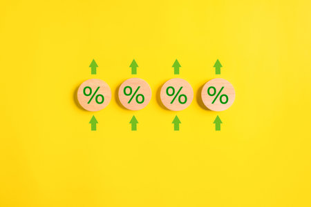 Wooden blocks with arrow up and percentage sign, Interest rate increases, Profit from deposit money,...
