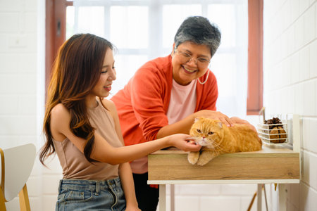 A senior with her daughter is depicted in a happy portrait at their home