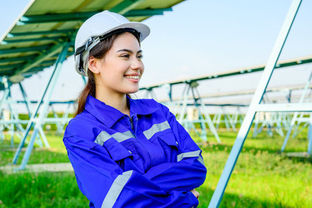 Engineer worker portrait with solar panels at solar farmの写真素材