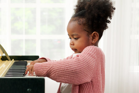 Kid playing piano, Daughter in piano class, Happy kid playing pianoの写真素材