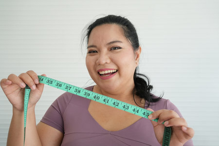 Happy chubby woman, happy, and vivacious plus-size women. Embrace the beauty of daily routines and the happiness that comes with them. High qualityの写真素材