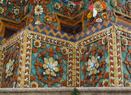 detail of traditional Thai pagoda with colorful glass clay tiles. ancient techique in public and historical Thai monasteries, Thailandの写真素材
