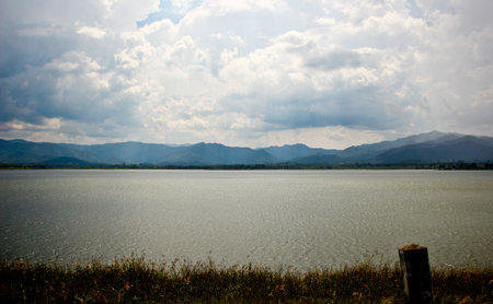 dam and lake with mountain and blue sky  thailandの写真素材