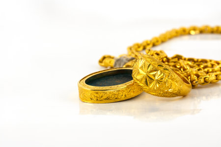 Jewelry gold on a white backgroundの写真素材