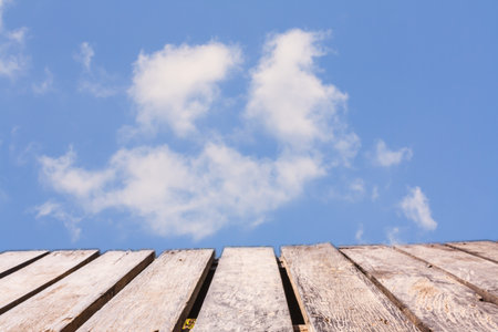 Wooden balcony on the sky backgroundの写真素材