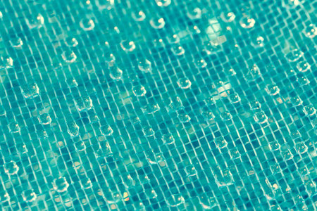 Water drops on blue meshの写真素材