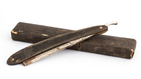 Old razor with cover on a white backgroundの写真素材