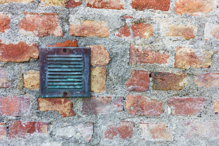 Brass plaque on the old wallの写真素材