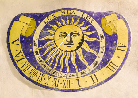 Sundial clock on old house wall in Italy - Riva di Solto -の写真素材