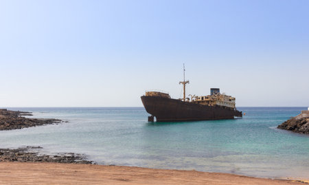 Old broken ship agrounded near Lanzarote seashore, Canary Islands, Spainの写真素材