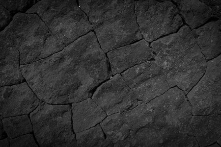 Dark grey black wall stone background or texture -lava textureの写真素材