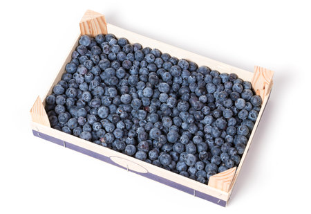 wooden box containing fresh blueberriesの写真素材