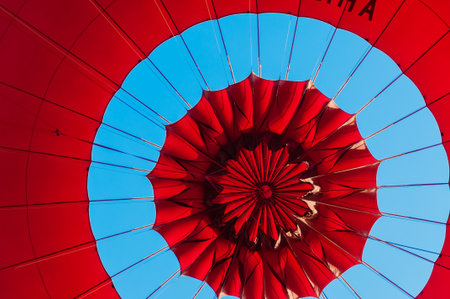 Top of a Red Balloon under a blue skyの写真素材