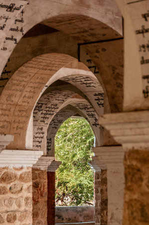 Inscriptions on an arc at a temple in Mandalayの写真素材
