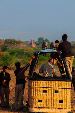 Hot air balloon crew working in basket Bagan Myanmar Burmaのeditorial素材