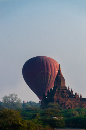 Hot air balloon behind temple in Bagan Myanmar Burmaのeditorial素材