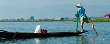 Fisherman at Inle Lake working on one foot Burma Myanmarの写真素材