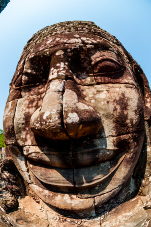 Head encarved in stone Bayon temple Angkor Wat Cambodiaの写真素材