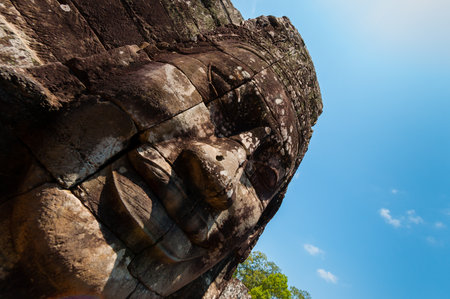 Head encarved in stone Bayon temple Angkor Wat Cambodiaの写真素材
