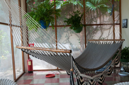 Big huge Hammock in black and white hanging inside a patio in colonial house in Granada Nicaraguaの写真素材