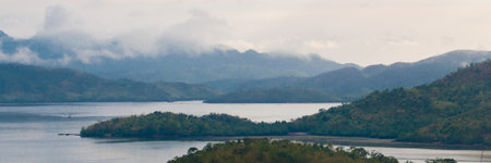 Big green Islands with fog and mist at the coast of Coron, Palawan, Philippinesの写真素材