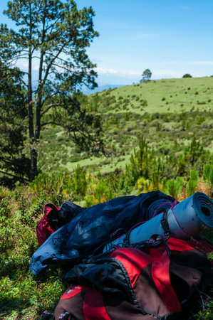 Backpack of a mountain hiker Laying on The Grass in the hilltop near Tajamulco Guatemalaの写真素材