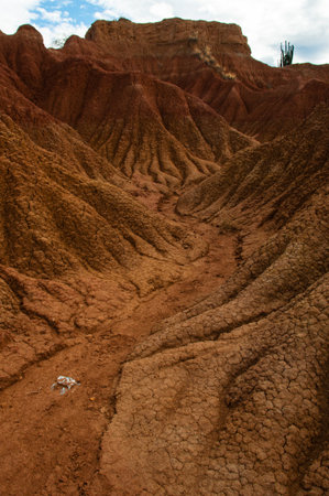 Drought valley red sandstone rock formation in hot dry desert of Tatacoa, Huila in Colombiaの写真素材