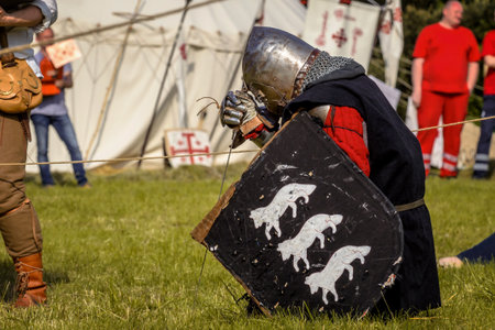 CHORZOW,POLAND, JUNE 9: Medieval Knight praying before fight during a IV Convention of Christian Knighthood on June 9, 2013, in Chorzowのeditorial素材