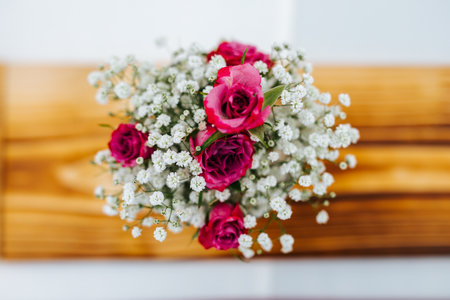 Colorful flower wedding center-piece decoration with pink roses from top viewの写真素材