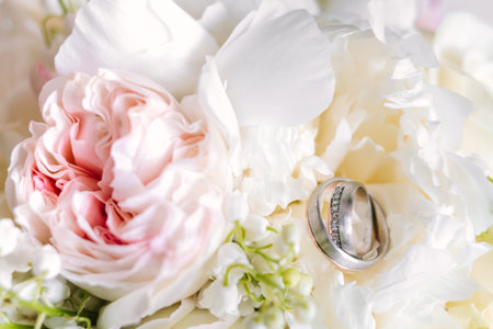Close up wedding bouquet with rings on top from top viewの写真素材