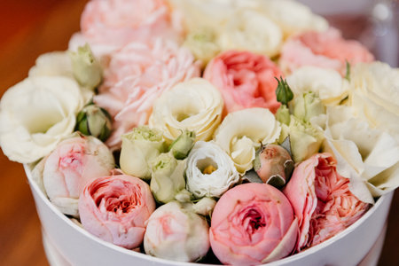 Colorful flower wedding center-piece decoration with pink and white roses in white bucket