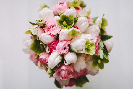 Wedding bouquet with white and pink roses from top view on white backgroundの写真素材