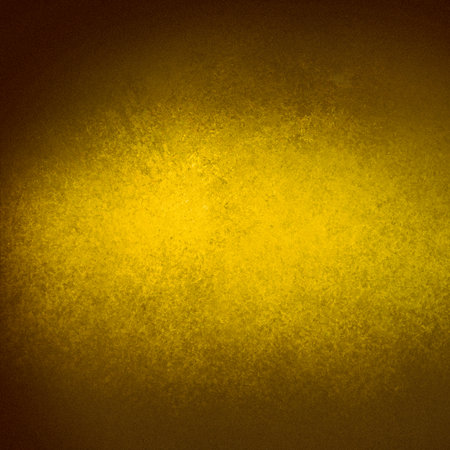 gold background with texture and bright beam of sunlight streaming on the center of the wallの写真素材