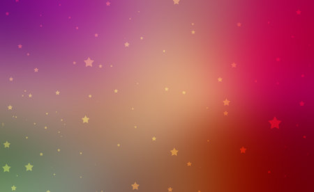 twinkling yellow stars on colorful sky background with blurred colors of gold purple pink red and green in soft abstract designの写真素材