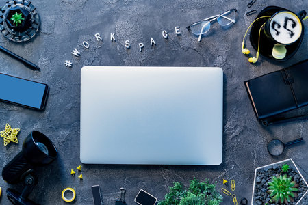 Workplace with gadgets, coffee cup and glasses