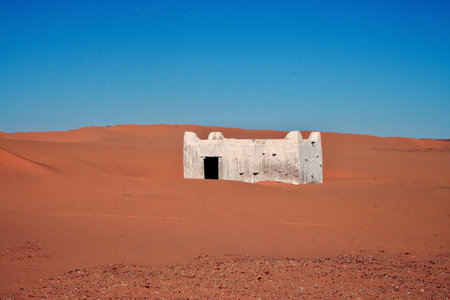 Holy place overgrown with sand in the desertの写真素材